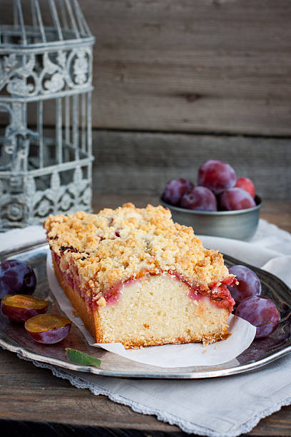 istock Homemade cake with plums on a metal tray 488387964