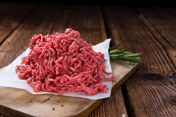 Minced Meat Minced Meat (close-up shot) on vintage wooden background ground beef photos stock pictures, royalty-free photos & images