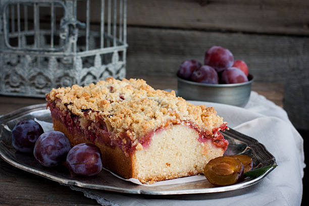 istock Homemade cake with plums on a metal tray 488388050