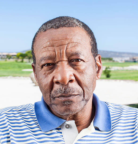 istock Serious african senior looking at the camera 488388117
