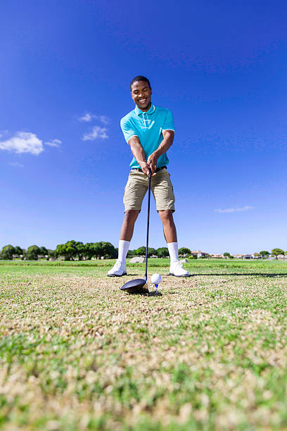 istock African golfer ready to drive the golf ball 488388129