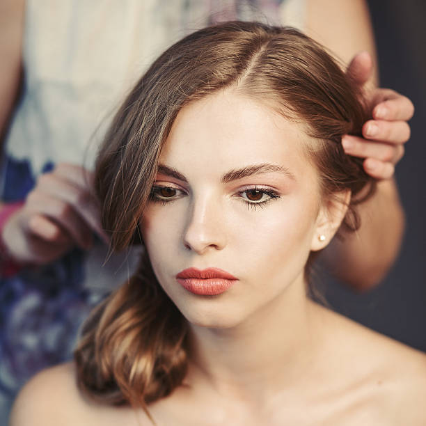 istock Professional hairdresser with model. 488390020