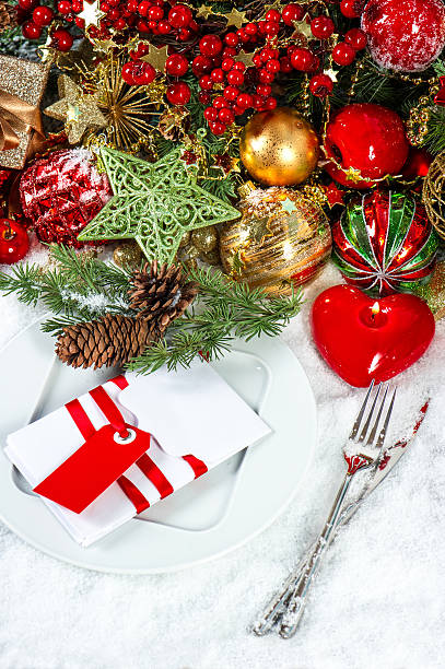 istock christmas table place setting with red heart candle 488390463