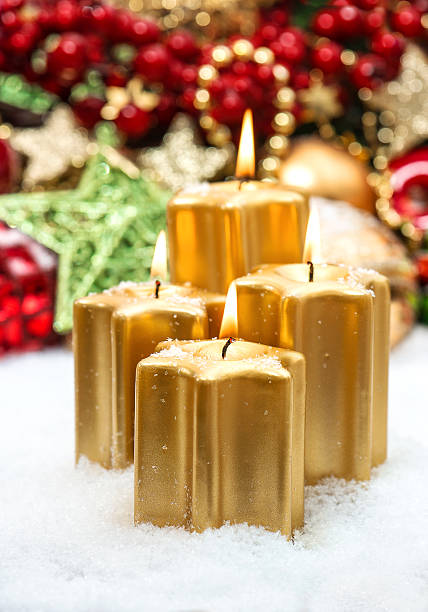 istock festive advent decoration with four burning candles 488390475