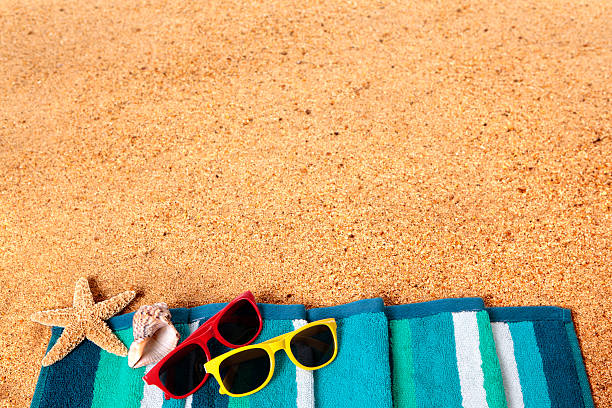 istock Beach background scene with sunglasses and starfish 488390675