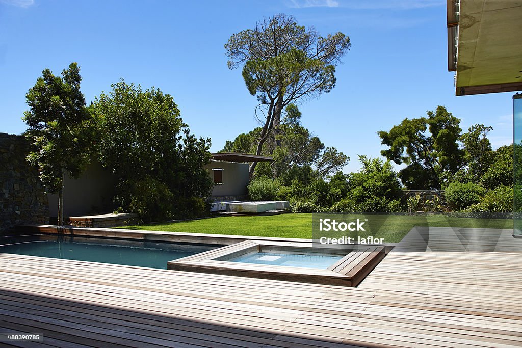 Modern living A contemporary back garden with swimming pool Yard - Grounds Stock Photo