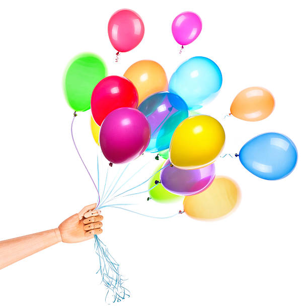 istock wooden hand gives flying balloons 488391449