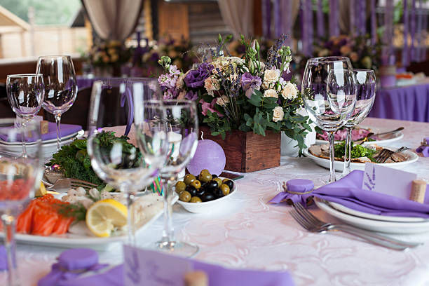 istock Flowers and empty wine glasses set in restaurant 488392340