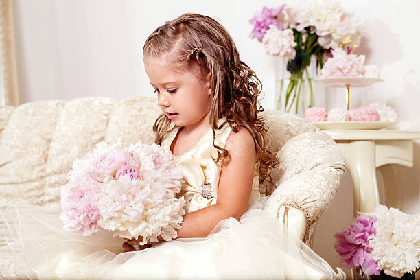 Flower girl with peony bouquet Flower girl with peony bouquet and sweets flower girl stock pictures, royalty-free photos & images