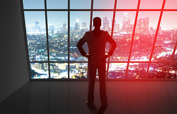 istock businessman looking to night city 488392638
