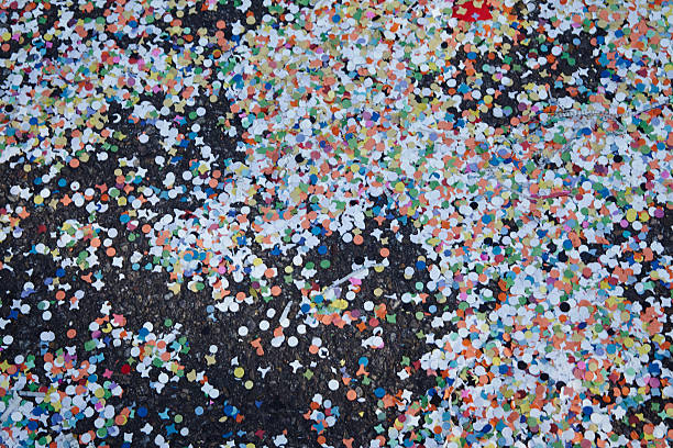 Basel (Switzerland) - Carnival 2014 The Carnival at Basel (Basle - Switzerland) in the year 2014. The picture shows some confetti laying on the street. fastnacht stock pictures, royalty-free photos & images