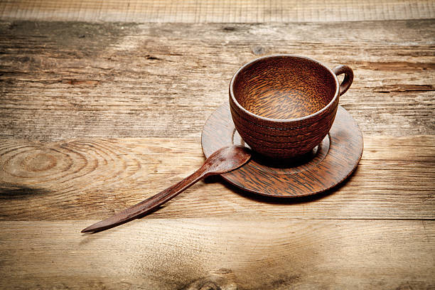 istock Wooden cup on old wooden table 488392775
