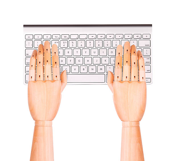 istock laptop with wooden hand isolated 488392899