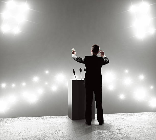 istock businessman standing on podium 488393194