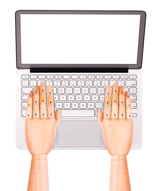 istock laptop with wooden hand isolated 488394925