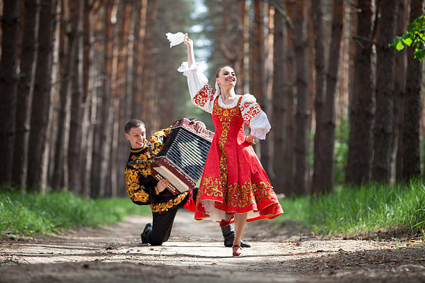 Man and woman in Russian national clothes stock photo
