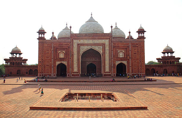 Agra, India - July 19, 2015:  The people visit to red tower of Taj Mahal complex. It is one of the most recognizable structures in the world and the biggest tourist highlights.Uttar Pradesh, India.