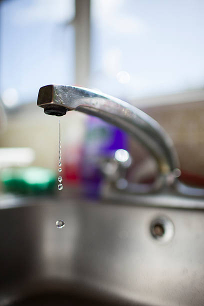 istock photo of a faucet head leaking 488401886