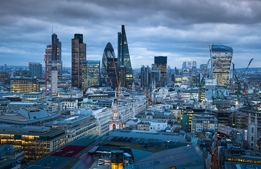 London, UK  - January 27, 2015:  City of London, business and banking area. London's panorama at sun set. View from the St. Paul cathedral