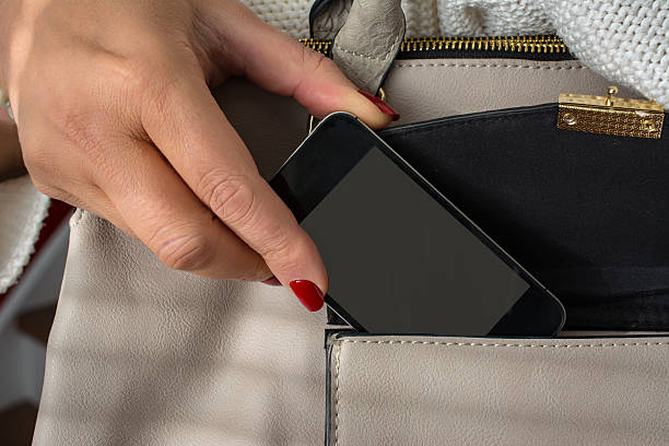 Elderly woman gets her phone (with display clipping path)