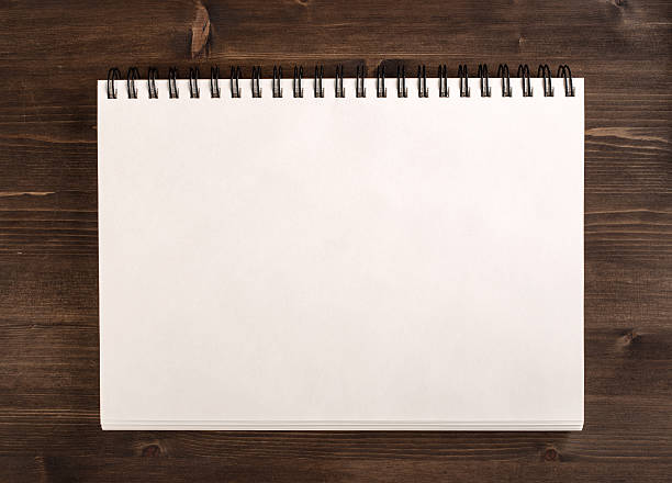 istock Notebook for sketches on wooden background 488405514