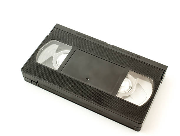 istock Old black magnetic videotape with the film 488406238