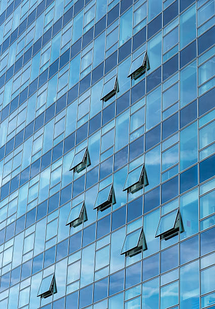 istock Architectural detail of a modern glass skyscraper building 488409096