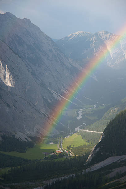 mountain panorama in karwendel european alps with rainbow