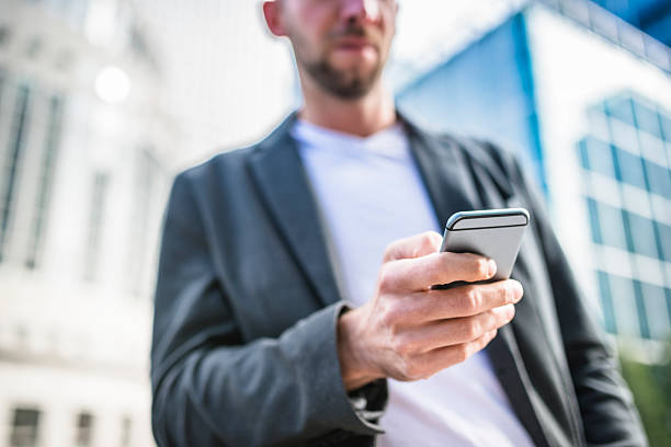 istock Business man on the phone in london 488413132