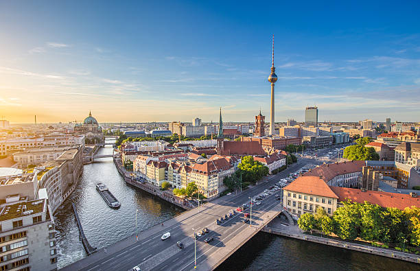 Berlin skyline with Spree river at sunset, Germany Aerial view of Berlin skyline with famous TV tower and Spree river in beautiful evening light at sunset, Germany. spree river photos stock pictures, royalty-free photos & images