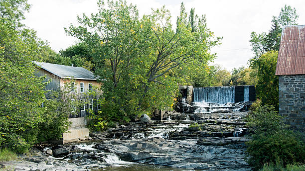 istock River with old mill and waterfall Gaspe, Quebec- late summer 488414746