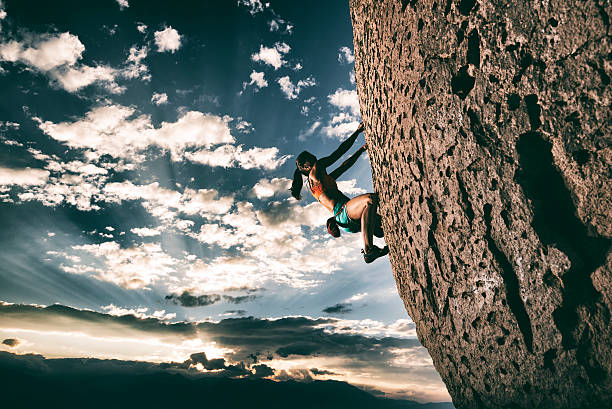 istock Strong girl rock climbing 488427686