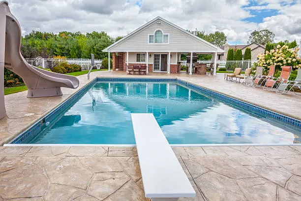 Photo of In Ground Swimming Pool with Pool-House, Slide, Diving Board.