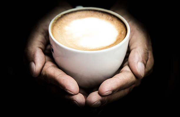 istock Man holding hot cup of coffee 488430018