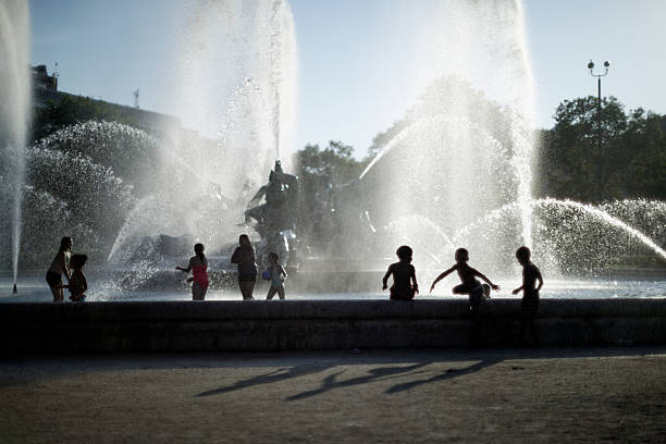 Philadelphia, PA, USA - August 15, 2015; Families enjoy a summer evening scene at the fountain on Logan Circle, in Center city Philadelphia, PA. The Parkway is the main location of the Francis Festival grounds during the planned visit of Poep Francis, for the World Meeting of Families, in the last week of September, 2015. (Photo by Bastiaan Slabbers)