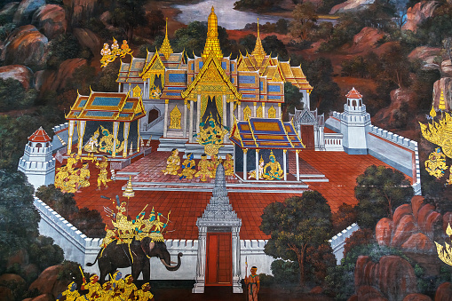 Bangkok, Thailand - December 19 2014: Mural paintings along the inner wall of the Wat Phra Kaew temple portrays the story of Ramayana epic saga