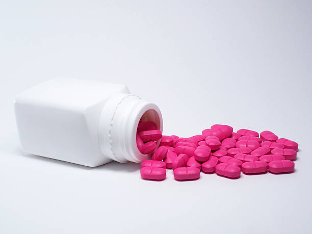 istock Pink medicine pills 488435642