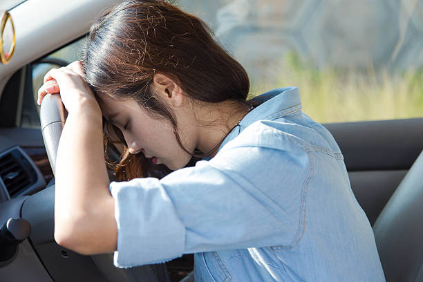 istock sad asian woman driver in car 488439472