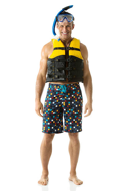 istock Happy young man standing with diving equipment 488442135