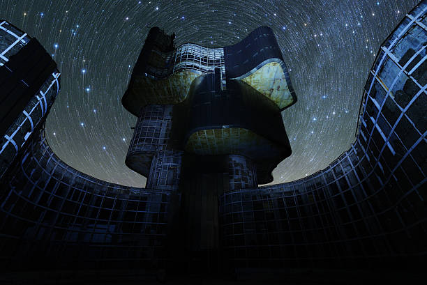 istock Star trails over an abandoned monument 488443180