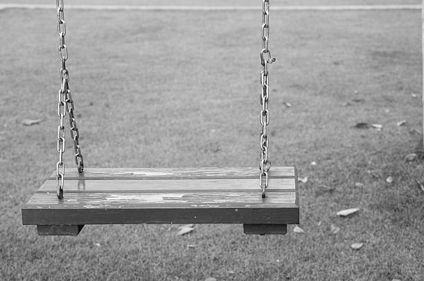 istock swing hanging in garden monochrome 488460976