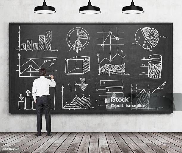 Student Of Finance Or Management Programme Is Drawing Some Charts Stock Photo - Download Image Now