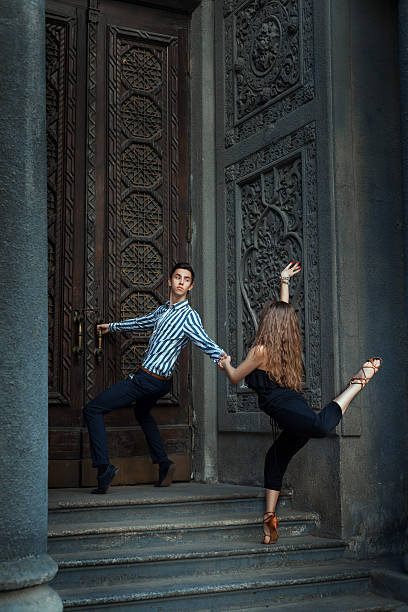 istock Girl and boy dancing in dance history. 488463582