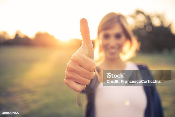 Young Woman With Thumbs Up Stock Photo - Download Image Now - Thumbs Up, OK Sign, Women