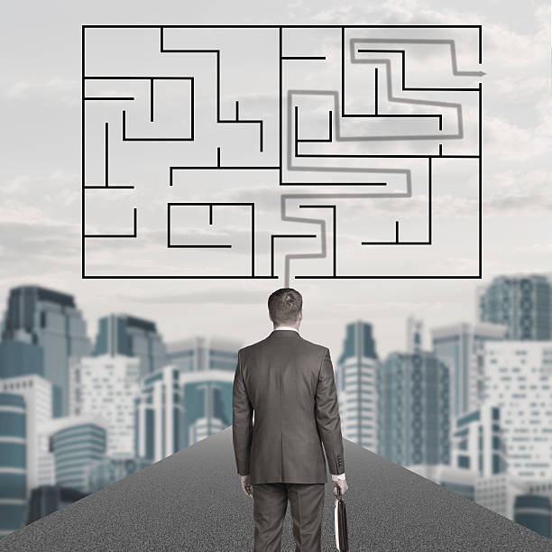 istock Businessman with suitcase and labyrinth 488464658