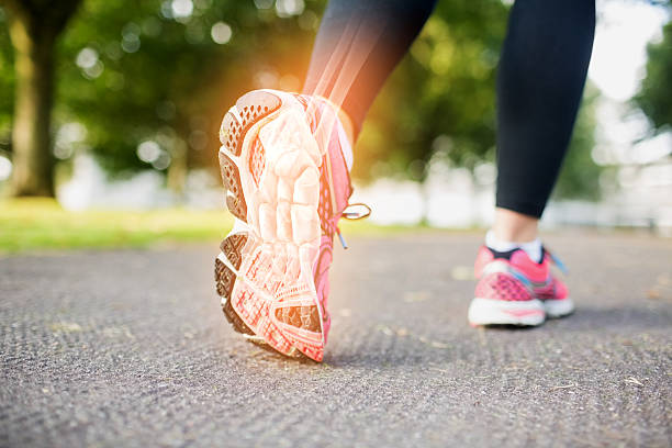 istock Highlighted foot bones of jogging woman 488465434