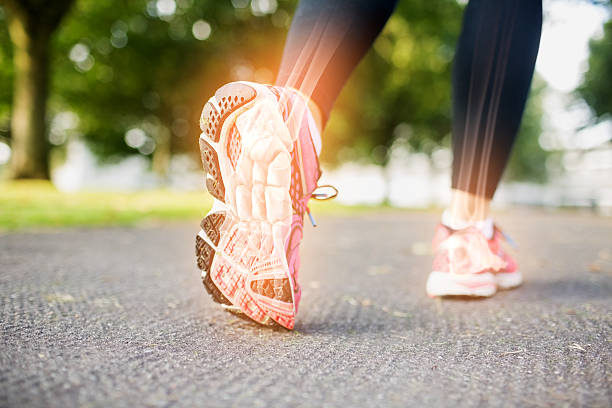 istock Highlighted foot bones of jogging woman 488465462