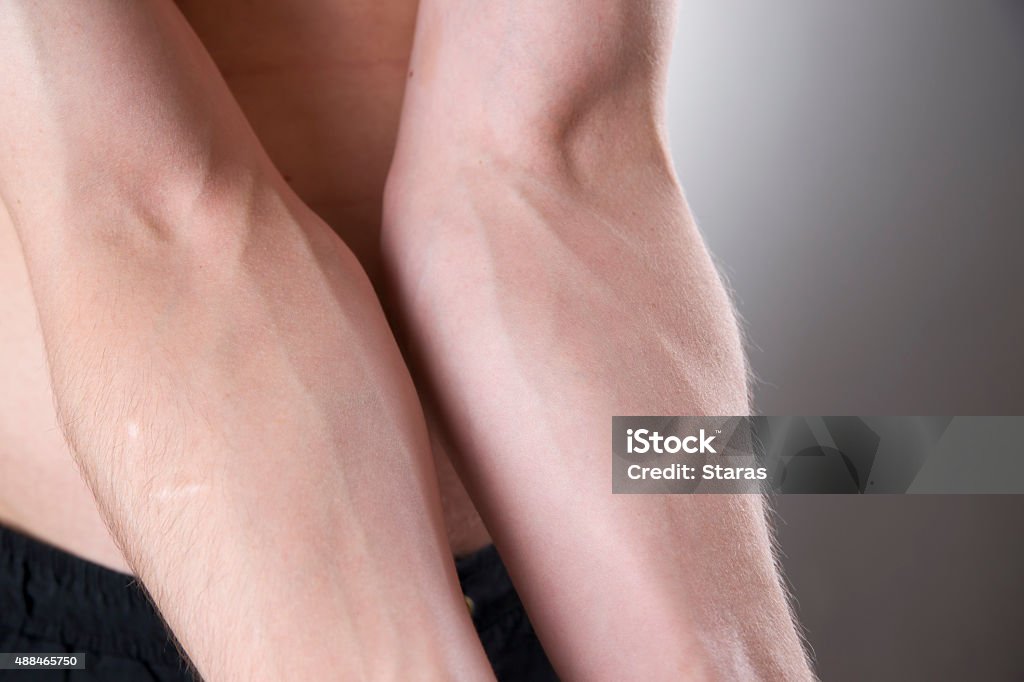 Human hands close-up Human hands close-up on a gray background Forearm Stock Photo