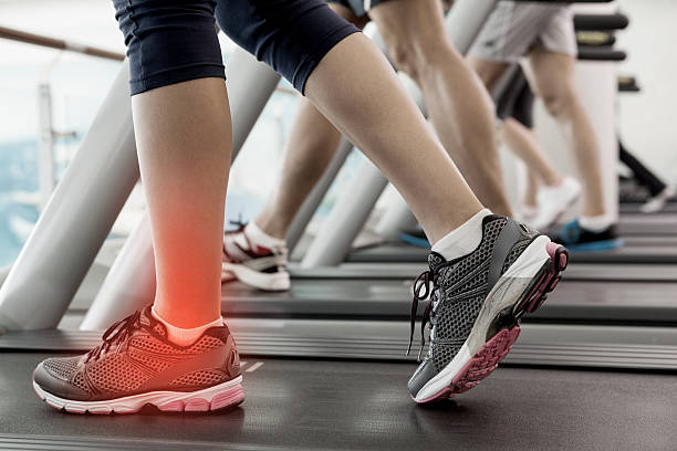 istock Highlighted ankle of woman on treadmill 488466104