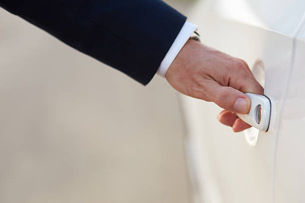 istock Businessman opening a car door 488467622